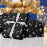 Elegant Black Winter Greenery Botanical Christmas Wrapping Paper<br><div class="desc">This elegant holiday wrapping paper features a beautiful pattern of watercolor white winter, berries and foliage over a chic black background. This wrapping paper coordinates with our Elegant Winter Greenery Botanical holiday photo cards.</div>