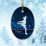Elegant Blue Lights Silver Ice Skater Ceramic Ornament<br><div class="desc">This elegant ornament features a silver silhouette ice skater against a pretty blue background with tiny star lights. Her name is in silver on a semi transparent banner that is framed in white faux glitter. The back of the ornament has the same blue background with three custom text fields at...</div>