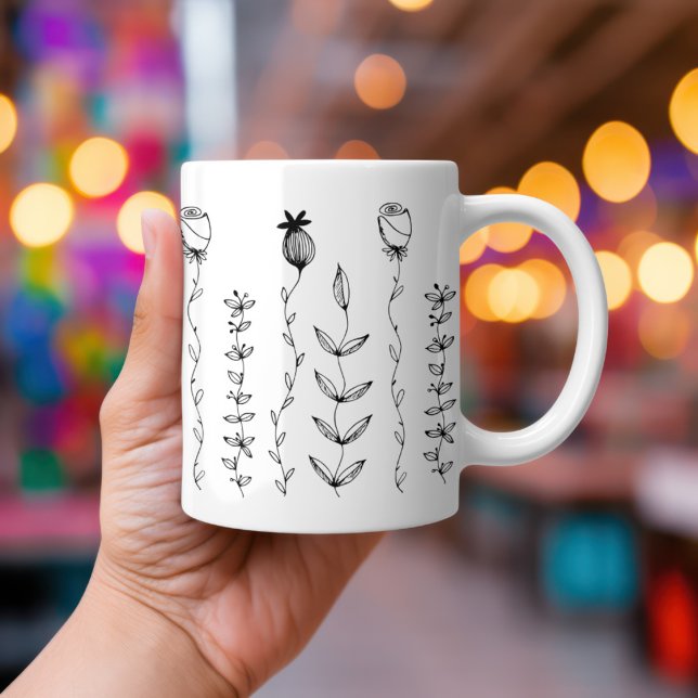 Elegant Boho Floral Illustration Coffee Mug (A hand holds a Hand-drawn simple Boho florals on a white mug.  Atmospheric lights in the background.)