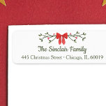 Elegant Bow & Holly Personalized Christmas Return<br><div class="desc">Add a touch of festive elegance to your holiday mailings with this charming personalized Christmas return address label. Featuring a classic red bow with holly accents and customizable family name and address text, it’s perfect for sending holiday cheer with style. The refined red and green colour palette brings a cozy,...</div>