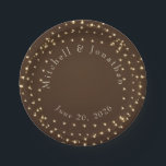 Elegant Brown & Gold String Lights Wedding  Paper Plate<br><div class="desc">Elevate your wedding reception or rehearsal dinner with these elegant paper plates. Featuring a warm espresso brown background and a shimmering wreath of golden string lights, this design perfectly captures a romantic, "under the stars" ambiance. Fully customizable with the couple’s names and wedding date for a personalized touch to your...</div>