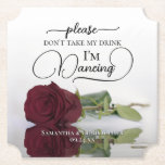 Elegant Burgundy Rose Don't Take My Drink Wedding Paper Coaster<br><div class="desc">This wedding coaster is elegant, stylish, and fun! It features a photo of a single long-stemmed burgundy, maroon, or wine-red coloured rose lying on its side mirrored in a pool of water. The text reads "Please don't take my drink, I'm dancing" written in modern script lettering. There is space for...</div>