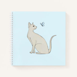 Elegant cat with butterfly notebook