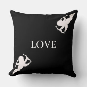 Elegant cupids in white on black throw pillow