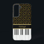 Elegant Custom Piano Keys with Gold Quatrefoil Samsung Galaxy Case<br><div class="desc">An elegant music design featuring piano keys with a golden quatrefoil pattern on a black background. Customizable text is featured on a golden and black accent for your name. Perfect for the pianist, piano student or the piano lover. Please note that there is no real gold or gold foil in...</div>
