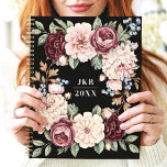Elegant Dark Floral Wreath Custom Monogram Planner<br><div class="desc">This sophisticated design features a lush floral wreath with rich blooms in shades of burgundy, blush, and cream, accented by soft greenery and berries. The dark black background enhances the timeless elegance of the floral arrangement, while the customizable initials and year make it unique and personal. Perfect for professionals, students,...</div>
