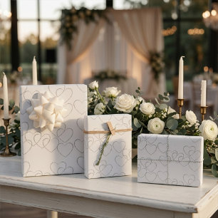 Elegant Decorative Silver Heart Charms on White Wrapping Paper Sheet