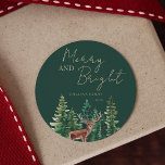 Elegant Deer Christmas Family Name Classic Round Sticker<br><div class="desc">Rustic green trees and deer "Merry and bright" personalized stickers.</div>