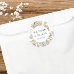 Elegant Earthy Floral White Wedding Favour Classic Round Sticker<br><div class="desc">This lovely favour sticker design features beautiful neutral colour florals with your names and wedding date. This timeless design is an excellent choice for many styles of events, from classic to boho. Customized favour labels make a wonderful addition to your wedding reception or bridal shower decor... and adds that extra...</div>