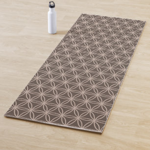 Elegant flower of life on brown background yoga mat