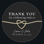 Elegant Gold Black Wedding Thank You Sticker<br><div class="desc">Show your appreciation with timeless elegance using this gold and black wedding thank you sticker. Featuring a romantic gold rope heart, classic black background, and elegant calligraphy, this round sticker is perfect for sealing favours, envelopes, or gift bags. Personalize it with your names and wedding date to add a heartfelt...</div>