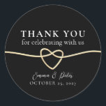 Elegant Gold Black Wedding Thank You Sticker<br><div class="desc">Show your appreciation with timeless elegance using this gold and black wedding thank you sticker. Featuring a romantic gold rope heart, classic black background, and elegant calligraphy, this round sticker is perfect for sealing favours, envelopes, or gift bags. Personalize it with your names and wedding date to add a heartfelt...</div>