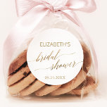 Elegant Gold Calligraphy Bridal Shower Favour Classic Round Sticker<br><div class="desc">These elegant gold calligraphy bridal shower stickers are perfect for a simple wedding shower. The neutral design features a minimalist sticker decorated with romantic and whimsical faux gold foil typography. Personalize the stickers with the name of the bride-to-be and the shower date. Please Note: This design does not feature real...</div>