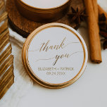 Elegant Gold Calligraphy Thank You Wedding Favour Classic Round Sticker<br><div class="desc">These elegant gold calligraphy thank you wedding favour stickers are perfect for a simple wedding. The neutral design features a minimalist sticker decorated with romantic and whimsical faux gold foil typography. Personalize the sticker labels with your names, the event (if applicable), and the date. These stickers can be used for...</div>