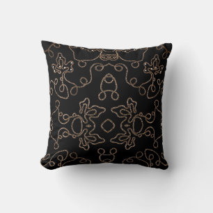 Elegant gold embellishments on black throw pillow