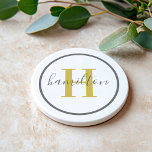Elegant Gold Grey Round Custom Monogram Initial Coaster<br><div class="desc">Elegant round personalized beverage drink coaster design features a classic custom serif monogram initial in a gold colour with your last name in modern grey calligraphy script against a clean white background. A simple grey circle frames the design. Colour scheme can be customized to coordinate perfectly with your home decor....</div>