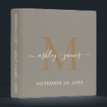 Elegant Gold Monogram Script Grey Wedding Binder<br><div class="desc">Chic wedding album with your stylish monogram initial in gold and your names in white elegant handwritten script calligraphy on a felted wool grey background. Simply add your names, monogram and wedding date. A beautiful wedding keepsake gift album for all your wedding photos and memories. Exclusively designed for you by...</div>