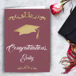 Elegant Gold Ornament Congratulations Graduate Card<br><div class="desc">Elegant Gold Ornament Congratulations Graduate Graduation Card. Graduation card with graduation cap,  trendy script and gold ornaments on burgundy red background. Congratulations and the name of the graduate on the front side - personalize with your name. Personalize the text inside the card or erase it.</div>