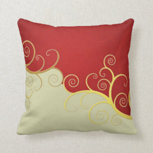 Elegant golden swirls on red and cream throw pillow