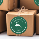 Elegant Green Merry Christmas Reindeer Custom Gift Classic Round Sticker<br><div class="desc">An elegant white reindeer leaps underneath Merry Christmas. Personalize these green holiday gift labels your family name underneath for beautiful custom presents.</div>