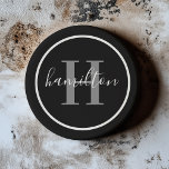 Elegant Grey Black Round Custom Monogram Initial Coaster<br><div class="desc">Elegant round personalized beverage drink coaster design features a classic custom serif monogram initial in pewter grey with your last name / surname in modern white calligraphy script against a black background. A simple white circle frames the design. Colour scheme can be customized to coordinate perfectly with your home decor....</div>