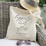 Elegant Happily ever after Personalized Wedding Tote Bag<br><div class="desc">This personalized wedding tote bag is the perfect accessory for any bride-to-be or newlywed couple. The design features an elegant script font with the words "Happily Ever After" in a delicate calligraphy style, making it a romantic and timeless piece. The bag is a spacious interior that can hold all your...</div>