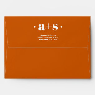 Elegant initials burnt orange wedding envelope