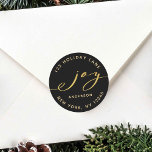 Elegant Joy Black & Gold Christmas Return Address Classic Round Sticker<br><div class="desc">This stylish sticker features an elegant gold joy script with the family name and return address on a black background (changeable background colour). For more advanced customization of this design,  please click the "customize further" link.</div>