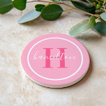 Elegant Light Pink Round Custom Monogram Initial Coaster<br><div class="desc">Elegant round personalized beverage drink coaster design features a classic custom serif monogram initial in a hot magenta pink colour with your last name in modern white calligraphy script against a pretty light pink background. A simple white circle frames the design. Colour scheme can be customized to coordinate perfectly with...</div>
