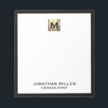 Elegant Luxury Monogram Notepad<br><div class="desc">Elevate your stationery game with this monogrammed notepad featuring classic block typography and a black frame with a brushed gold medallion monogram. The notepad includes space for custom text, such as your name and title, making it perfect for personal or professional use. Use it to jot down notes, ideas, and...</div>