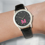 Elegant Minimalist Black Pink Monogram Watch<br><div class="desc">Personalized Monogram Black and White Watch with Simple White Numbers. This stylish, minimalist watch combines classic elegance with a personal touch, featuring a bold pink initial on a black face (note: the pink is a flat colour without any shimmer), accented by simple white numbers for easy reading. The design includes...</div>