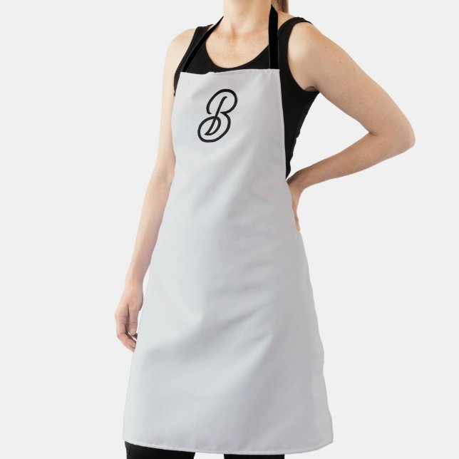 Elegant minimalist modern initial on grey apron (Insitu)