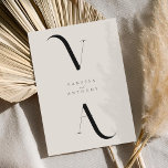 Elegant Modern Minimalist Black and Ivory Wedding Invitation<br><div class="desc">Modern Minimalist Black and Ivory Wedding Invitation. Features elegant monogram typography and minimal graphic design. Personalize text with all the details of your special day.</div>