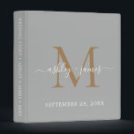 Elegant Monogram Grey & Gold Script Wedding Album Binder<br><div class="desc">Chic wedding album with your stylish monogram initial in gold and your names in white elegant handwritten script calligraphy on a silver grey background. Simply add your names, monogram and wedding date. A beautiful wedding keepsake gift album for all your wedding photos and memories. Exclusively designed for you by Happy...</div>
