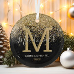 Elegant Monogram Name Christmas Glass Ornament<br><div class="desc">Family monogram christmas glass ornament featuring a trendy black background,  a elegant gold glitter waterfall design,  your initial,  family name,  first names,  and the year.</div>