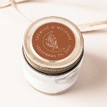Elegant Moon and Stars Terracotta Wedding Favour Classic Round Sticker<br><div class="desc">Add a personalized touch to your envelopes, wedding favours, and more with these Elegant Moon and Stars terracotta wedding stickers. The design features a light cream line art illustration of a moon adorned with stars and foliage on a terracotta background. Your names and wedding date are displayed in cream lettering....</div>