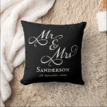 Elegant Mr and Mrs Wedding Black Throw Pillow<br><div class="desc">Keep a memory of your special day close with this lovely black and white Mr and Mrs throw pillow! Featuring gorgeous script calligraphy with customizable names and wedding date, this pillow will be a beautiful keepsake for years to come. Also makes a beautiful personalized wedding or anniversary gift for couples...</div>