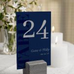 Elegant Navy Blue Grey Typography  Table Number<br><div class="desc">Elegant typography wedding table number cards in muted navy blue with TABLE in large letters down the side of the navy blue table number cards. Add names and wedding date in silver grey.</div>