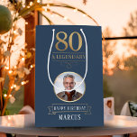 Elegant Navy & Gold 80th & Legendary Birthday Medium Gift Bag<br><div class="desc">Elegant Navy & Gold 80th & Legendary Birthday Gift Bag. Celebrate a truly legendary milestone with this elegant 80th birthday gift bag. Featuring a sophisticated navy background, bold gold-effect text, and a customizable photo and name, this design is perfect for honouring a loved one on their special day. The timeless...</div>