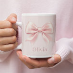 Elegant Pastel Pink Bow & Name Personalized  Large Coffee Mug<br><div class="desc">Sip in style with this elegant pastel pink mug featuring a delicate bow design and your personalized name. Perfect for adding a touch of charm to your morning coffee, tea, or any beverage. This chic mug makes a thoughtful gift for birthdays, holidays, or special occasions, blending practicality with a feminine,...</div>