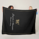 Elegant Personalized Newlywed Keepsake Monogram Fleece Blanket<br><div class="desc">Elegant Chic Black Personalized Newlywed Keepsake Monogram Fleece Blanket. Personalized black and gold monogrammed Fleece Blanket. Classic romantic script for the initial, the names of the bride and groom, and the wedding date on a simple elegant black background. A perfect gift idea for a wedding gift, a newly weds gift,...</div>