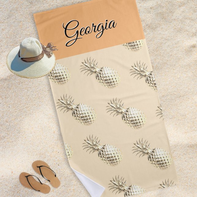 Elegant Pineapples Patterned Custom Name Peach Beach Towel (A beach towel with faux gold pineapples print, personalized with a name in elegant script typography)