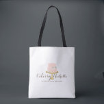 Elegant Pink Cake with Florals Bakery Tote Bag<br><div class="desc">An elegant pastel pink tiered cake decorated with white flowers sits atop a faux gold cake stand for a beautiful aesthetic on this bakery-themed personalized tote bag. Perfect for bakers,  catering companies,  cake decorators,  or for personal use. Design © 1201AM Design Studio</div>