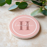 Elegant Pink Round Custom Monogram Initial Coaster<br><div class="desc">Elegant round personalized beverage drink coaster design features a classic custom serif monogram initial in a rosewood colour with your last name in modern white calligraphy script against a pretty blush pink / rose gold coloured background. A simple white circle frames the design. Colour scheme can be customized to coordinate...</div>