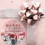Elegant Pink Silver Wrapped Gift Boxes Christmas Classic Round Sticker<br><div class="desc">Add a touch of sparkle to your holiday season with this customizable Christmas sticker! Set against a glittery pink backdrop, the sticker features the festive greeting "Merry Christmas", a combination of a red serif and a elegant black cursive font. Personalize it with your family name, like "The Brooks Family" shown...</div>