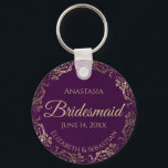 Elegant Plum Purple & Gold Bridesmaid Wedding Gift Keychain<br><div class="desc">These keychains are designed to give as favours to bridesmaids in your wedding party. They feature a simple yet elegant design with a deep plum purple coloured background, gold script lettering, and a lacy golden faux foil floral border. The text says "Bridesmaid" with space for her name, the names of...</div>