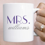 Elegant Purple Mrs Wedding Monogram Coffee Mug<br><div class="desc">This striking Mrs mug features oversized elegant serif typography in rich purple with a custom last name in delicate script beneath. The regal purple tone against a clean white background makes a sophisticated, elegant statement. The last name is fully editable for a personalized keepsake. A beautiful gift for the bride,...</div>