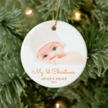 Elegant Script Baby's First Christmas Photo Ceramic Ornament<br><div class="desc">This round Christmas ornament offers a baby's first Christmas theme. The text "My 1st Christmas" appears in an elegant orange script. Custom text allows you to add the name and year of your newborn.</div>