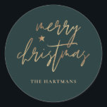 Elegant Script Merry Christmas Gold Star Dark Teal Classic Round Sticker<br><div class="desc">These stylish Christmas holiday stickers feature elegant typography reading,  "Merry Christmas" in faux gold foil,  along with a little star accent. The background colour can be customized to any colour you'd like! Great for use as envelope seals,  party favour labels,  or gift sticker labels!</div>