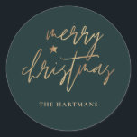 Elegant Script Merry Christmas Gold Star Dark Teal Classic Round Sticker<br><div class="desc">These stylish Christmas holiday stickers feature elegant typography reading,  "Merry Christmas" in faux gold foil,  along with a little star accent. The background colour can be customized to any colour you'd like! Great for use as envelope seals,  party favour labels,  or gift sticker labels!</div>